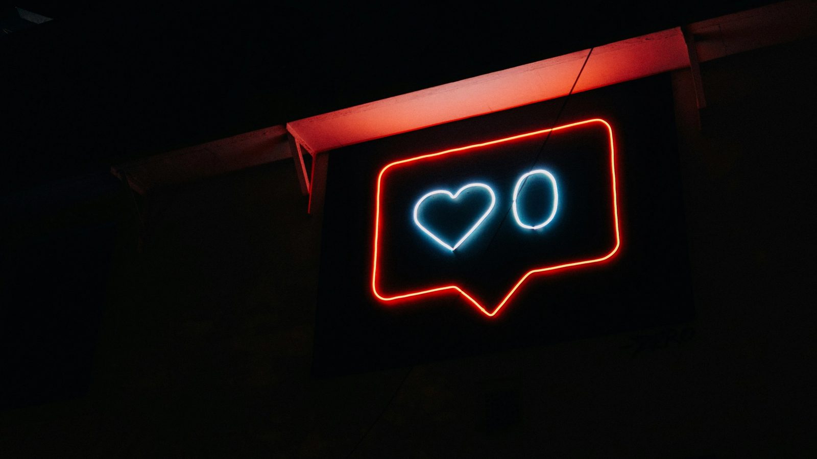 Main Image: Neon sign of an Instagram 'Like' icon showing zero likes
