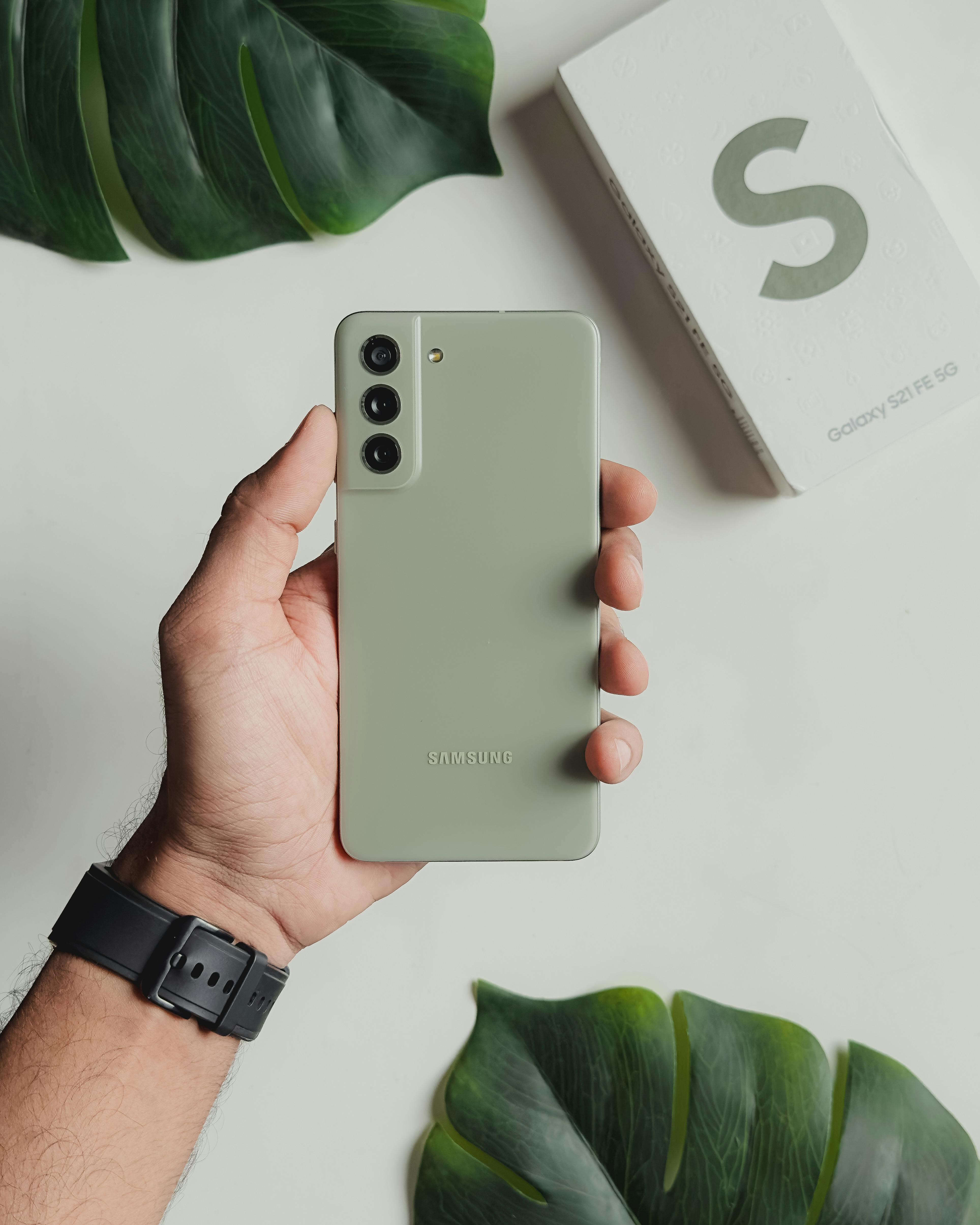 Close-up of a Man Holding a Green Samsung Galaxy S21