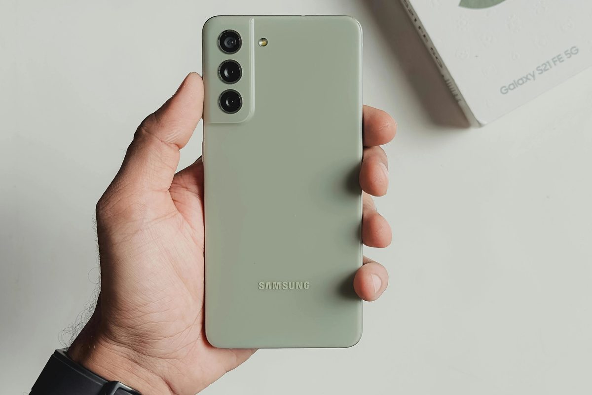 Close-up of a Man Holding a Green Samsung Galaxy S21
