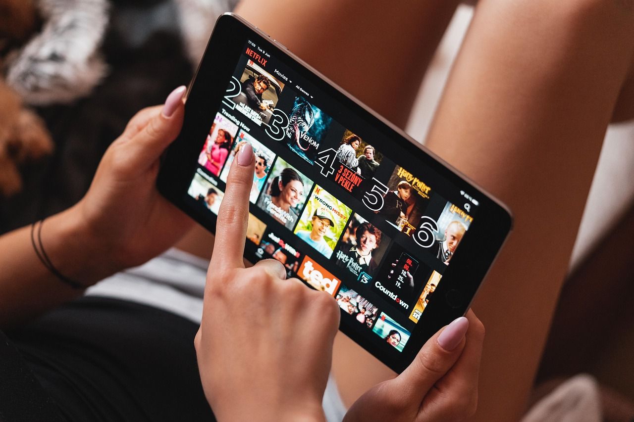 Girl watching Netflix on a tablet
