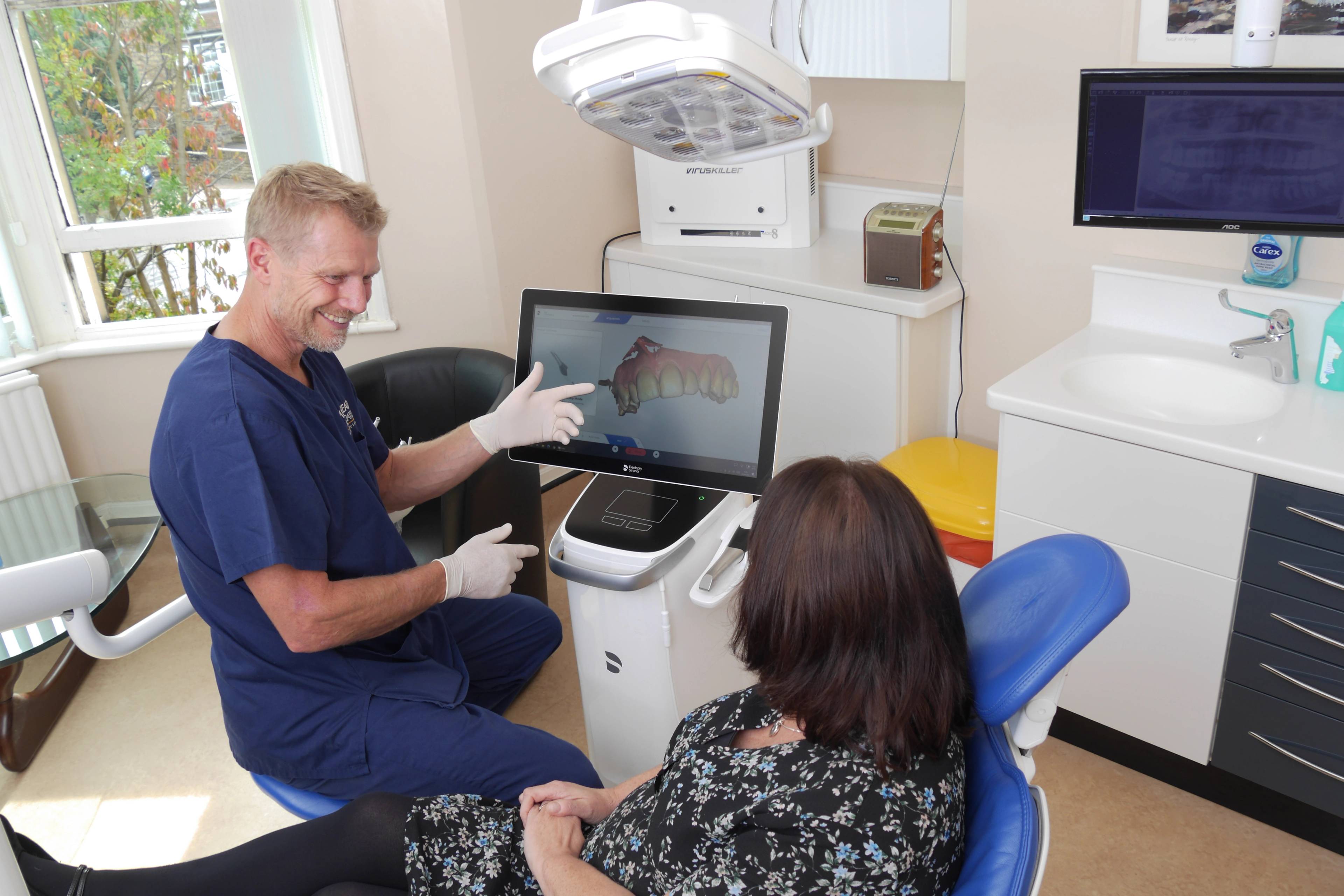 Robert Muirhead works with a patient's digital scans