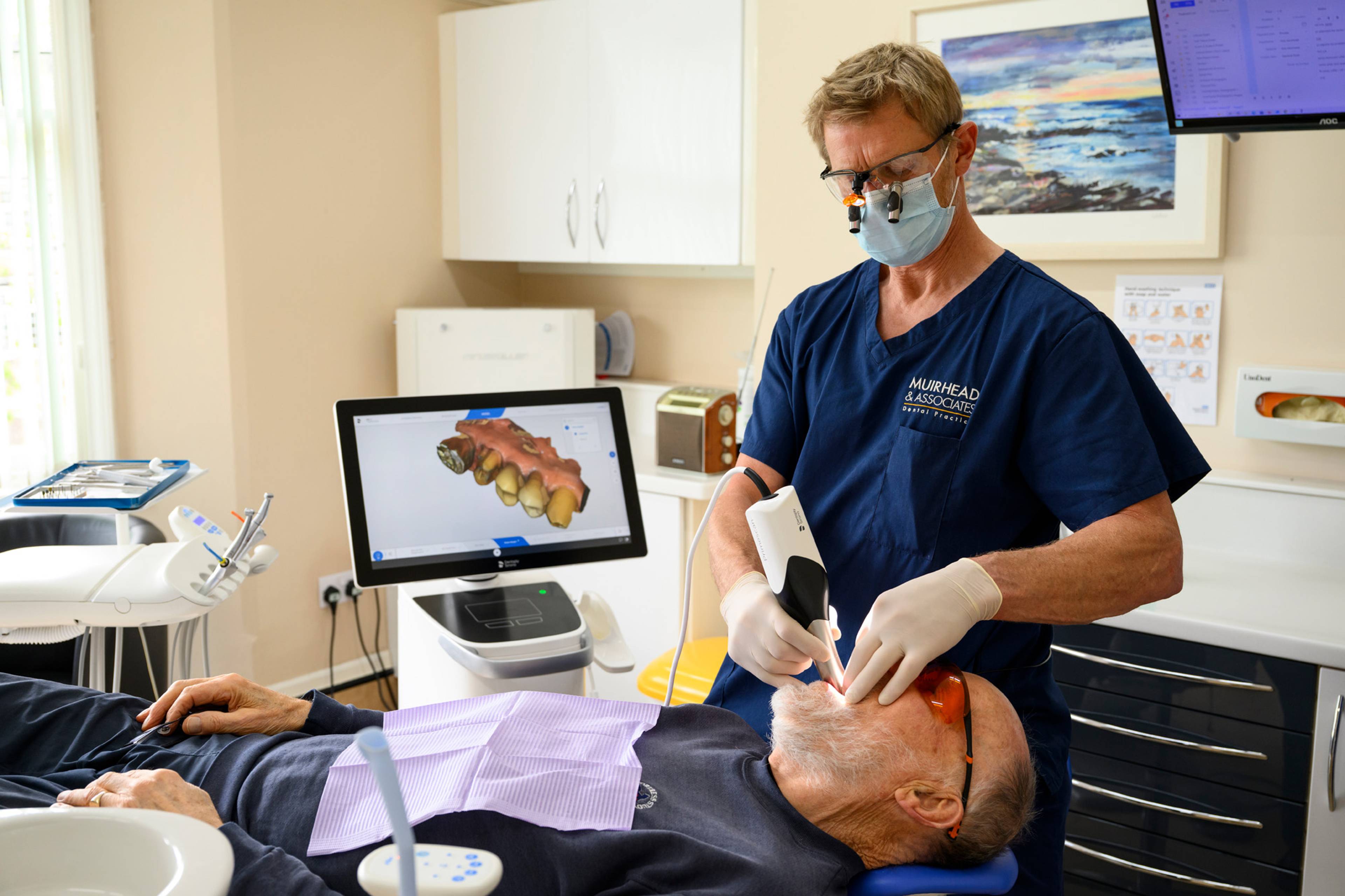 Robert Muirhead scanning a patient's mouth for same-day crowns