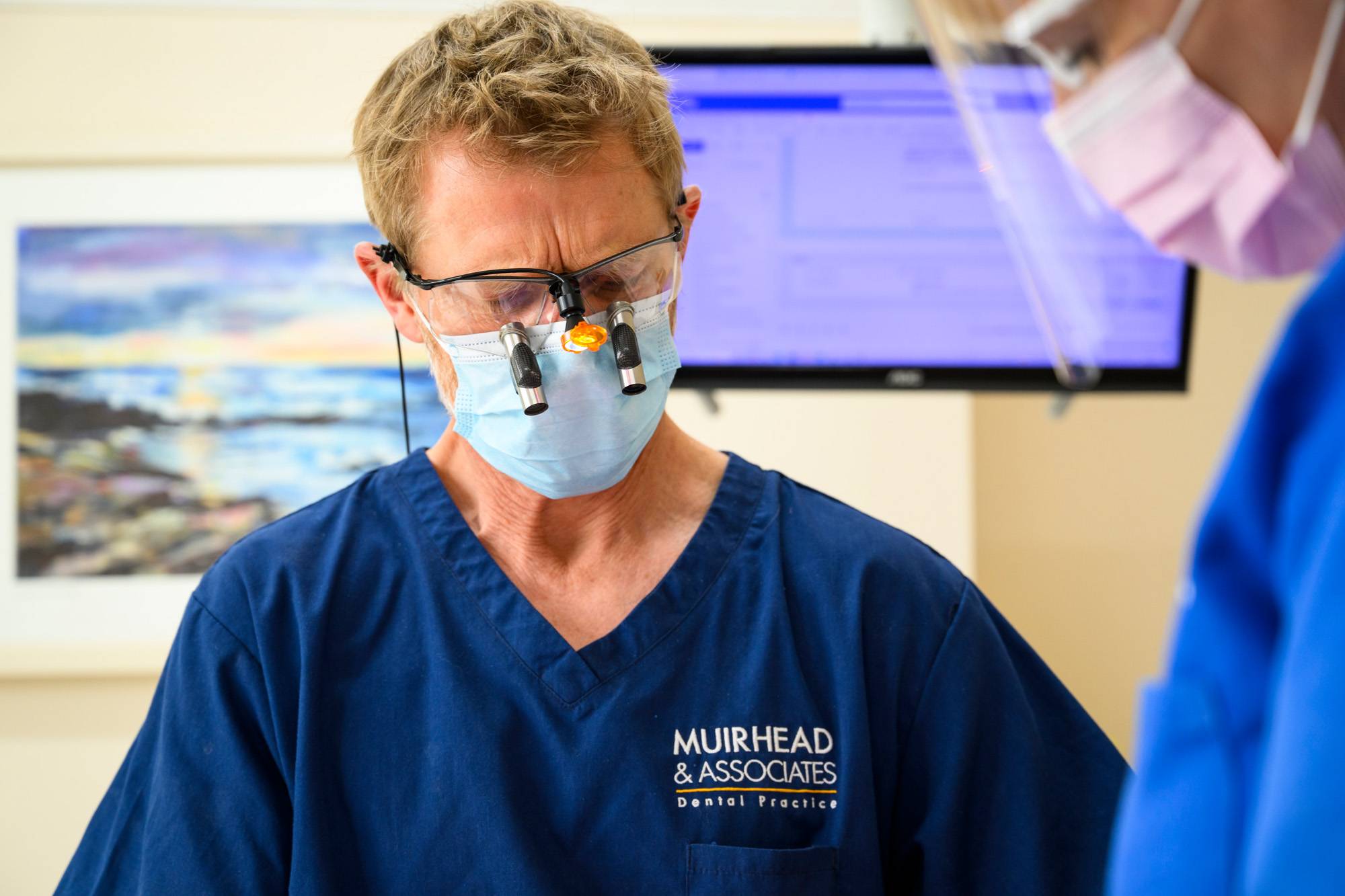 Rob Muirhead looking through loupes