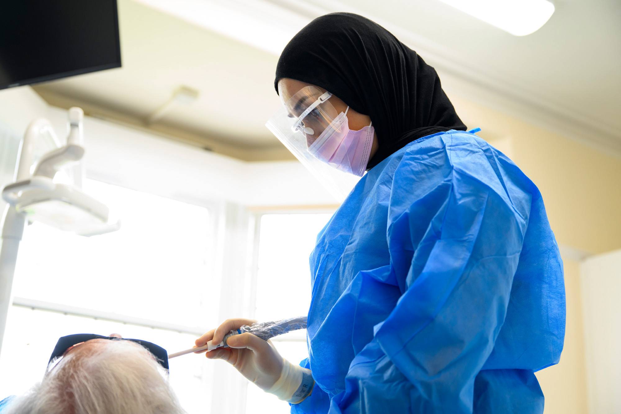 One of our dental nurses working on a patient