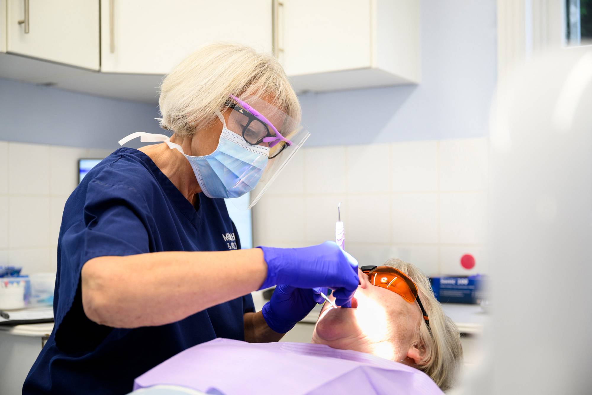 Our dental hygienist working on a patient