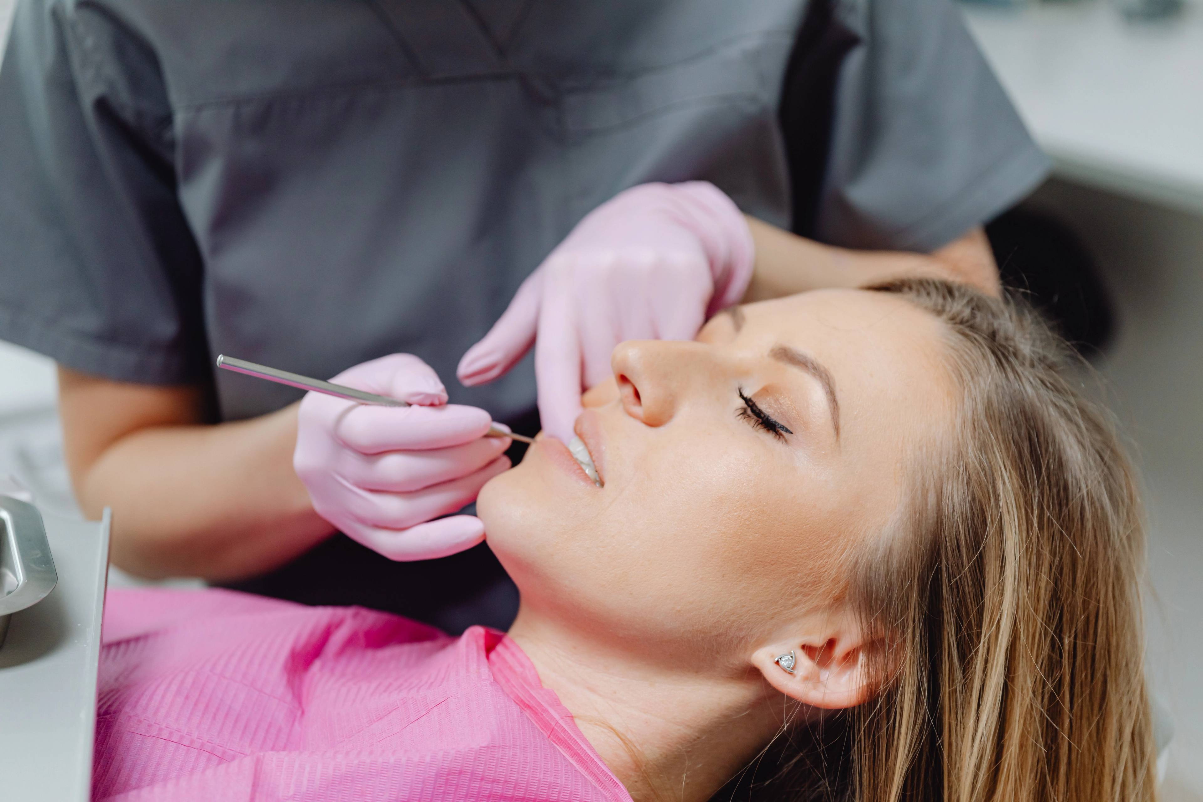 A stock photo of a woman having a dental exam