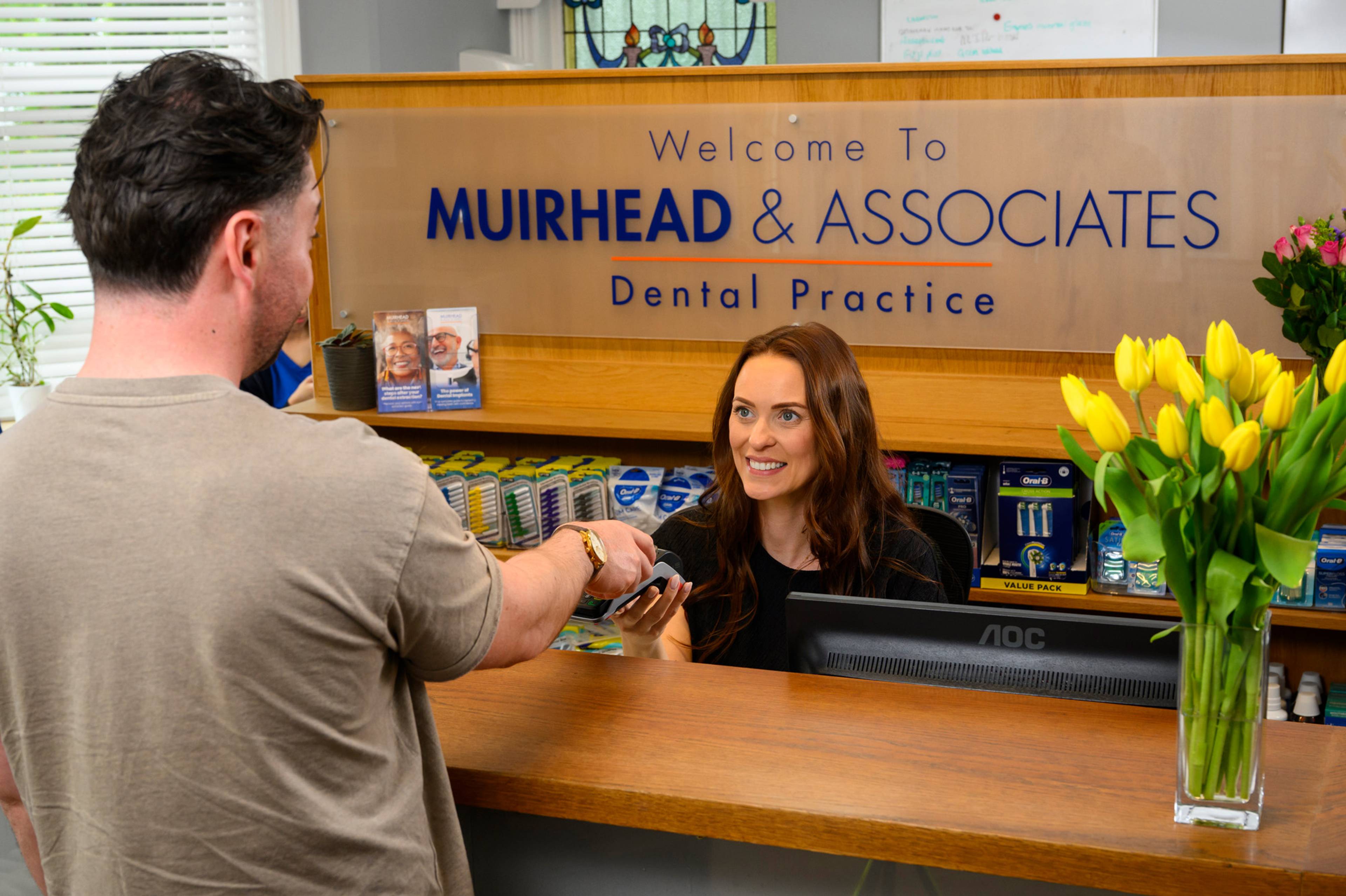 A patient paying for treatment