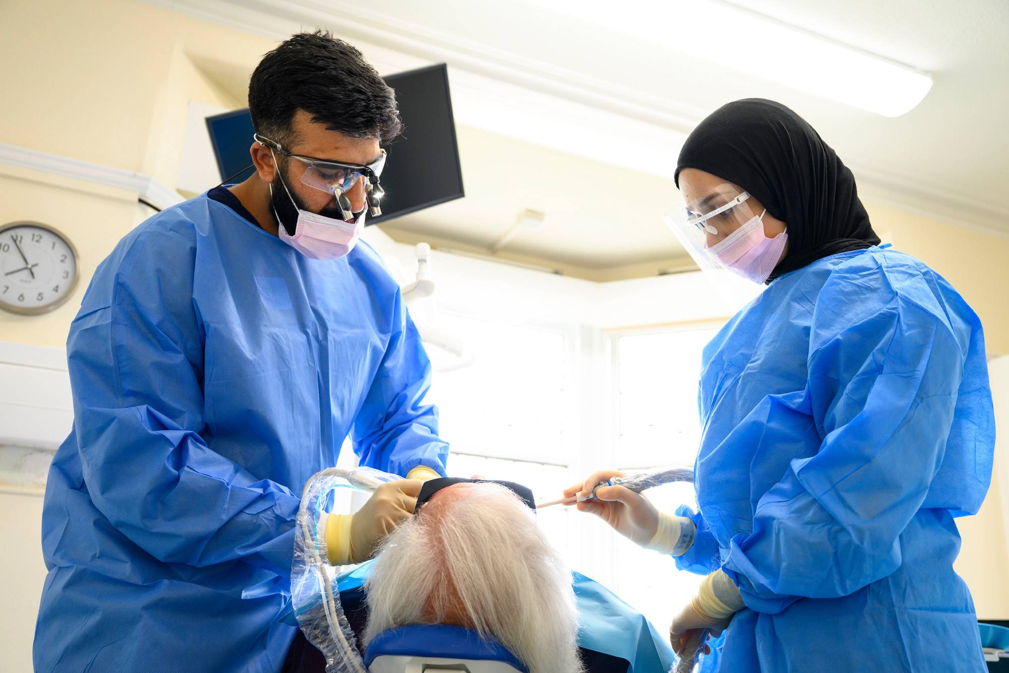 Ahmer and Shifah working on a patient