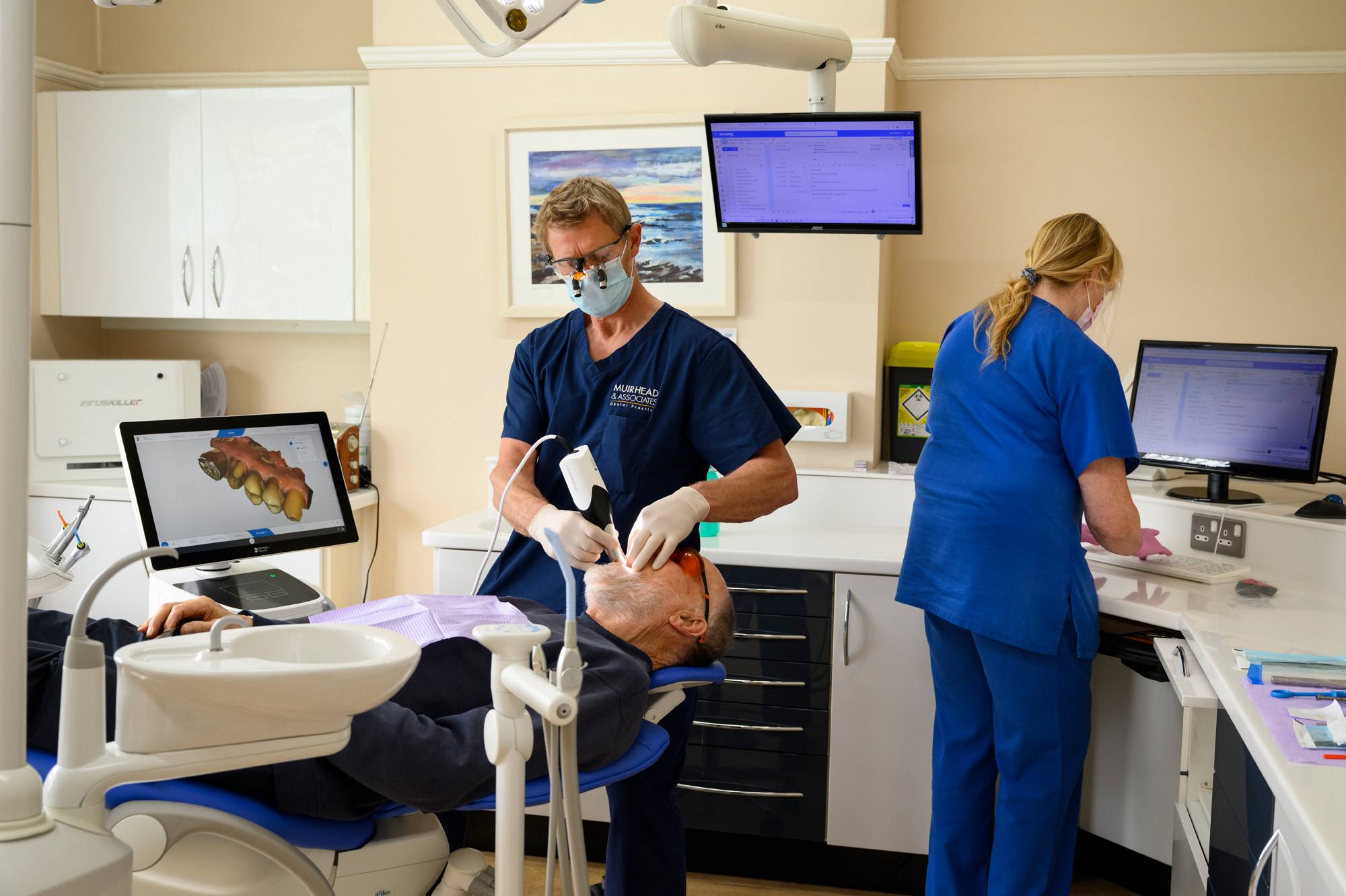 Robert Muirhead working on a patient