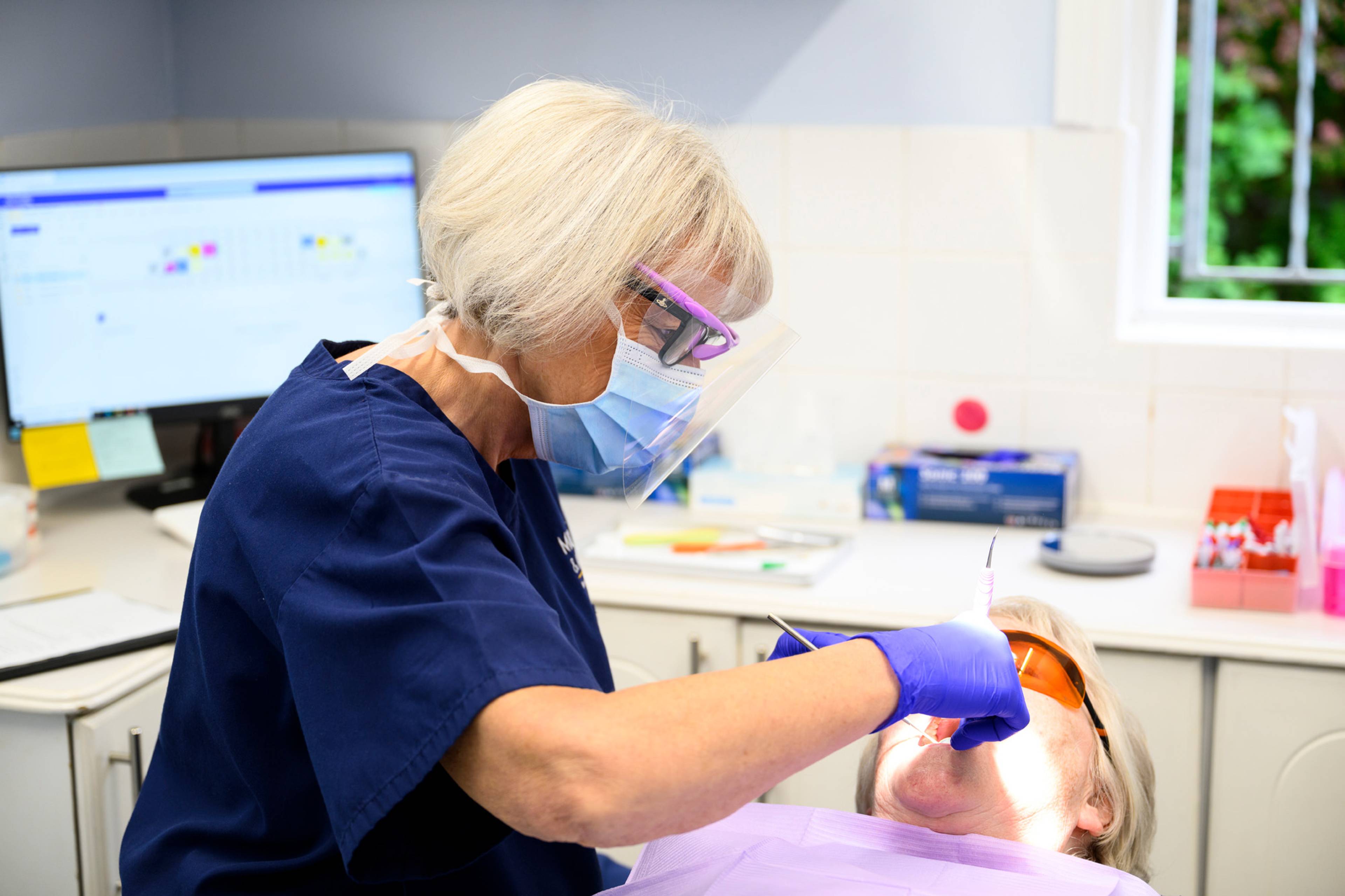 Rachel Smith working on a patient
