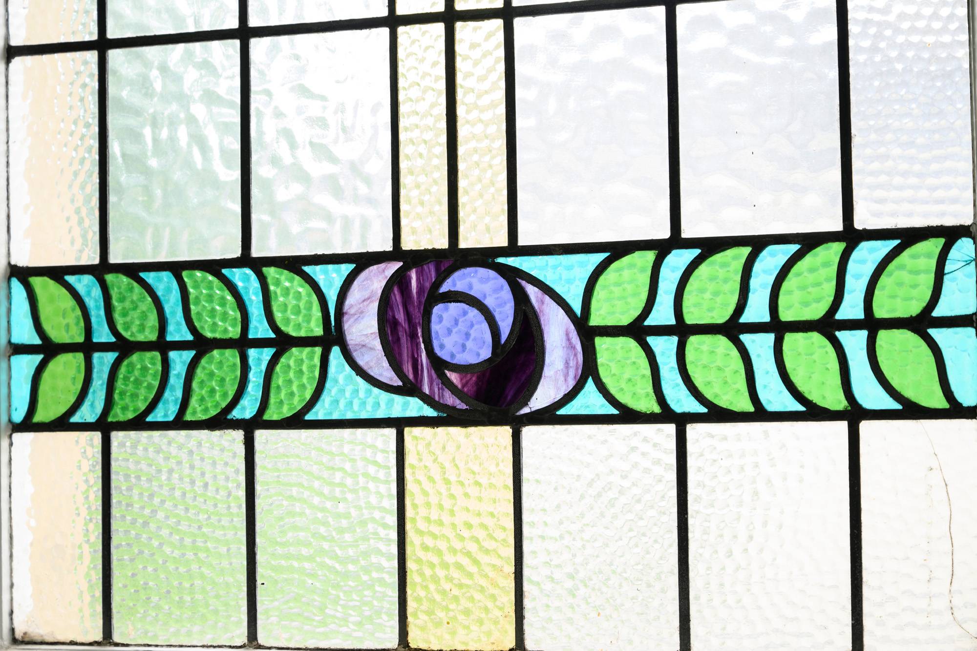 A close-up photo of one of our practice's stained glass windows