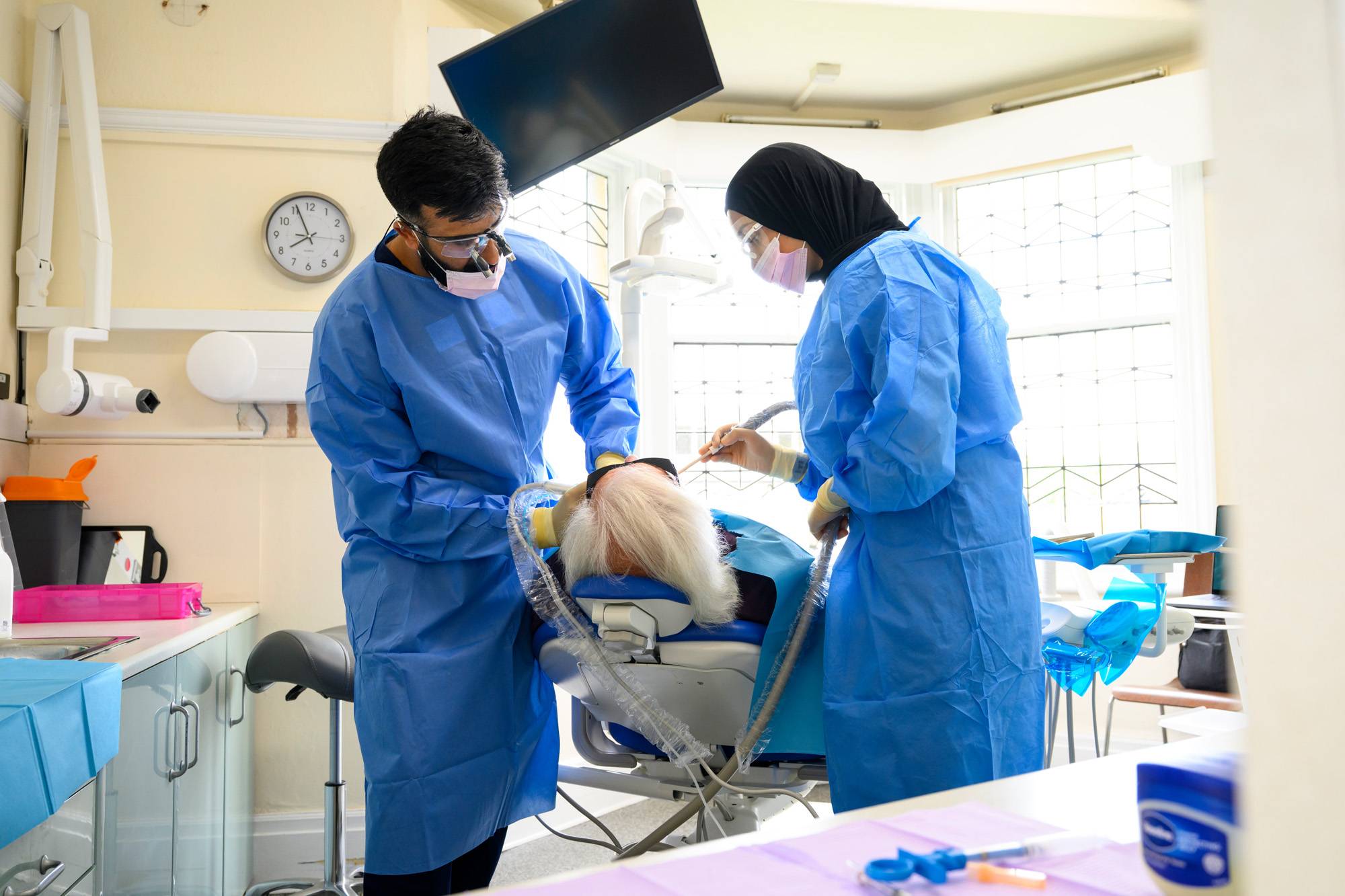 Ahmer and Shifah working on a patient
