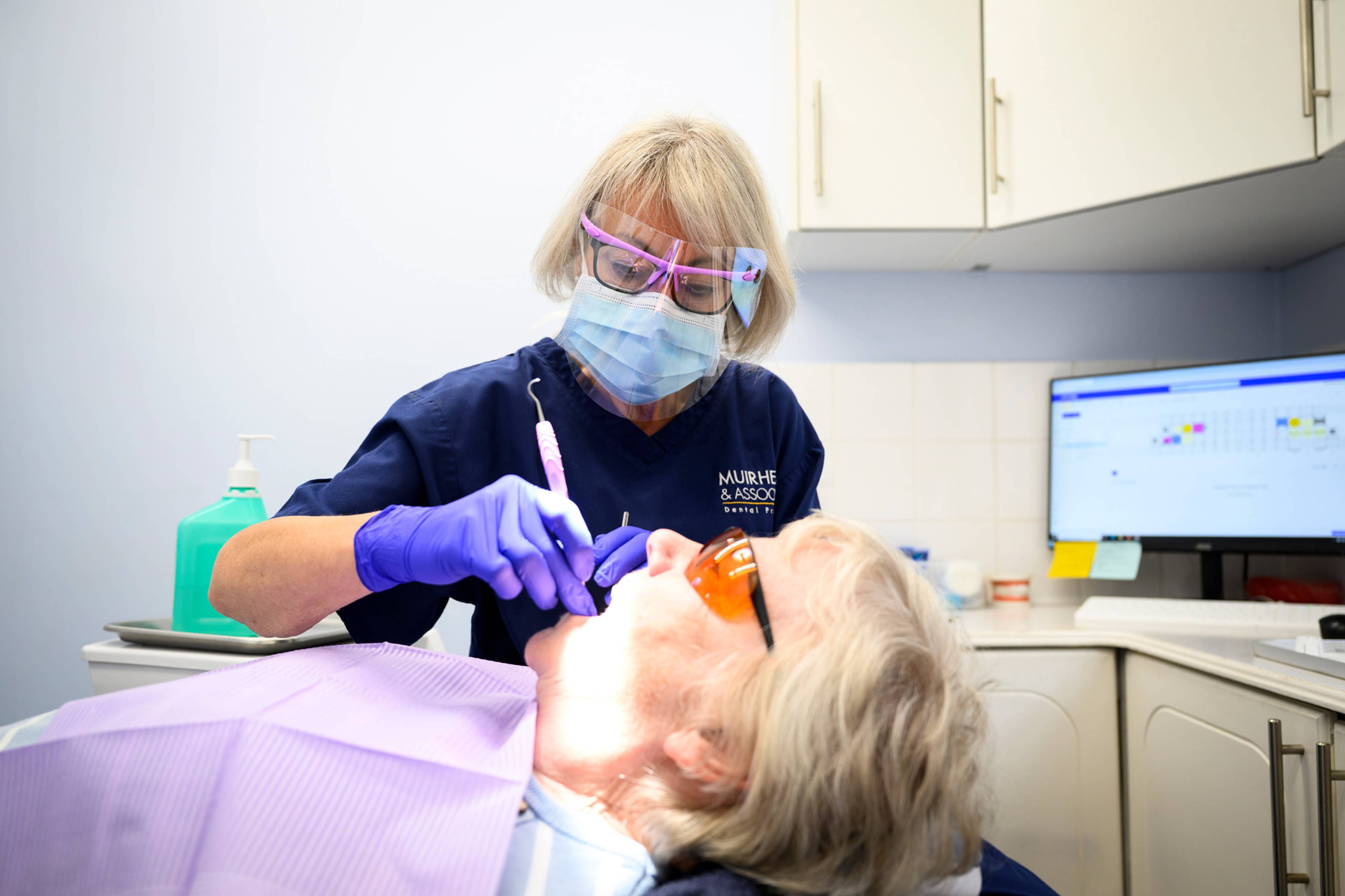 Dental hygienist Rachel working on a patient