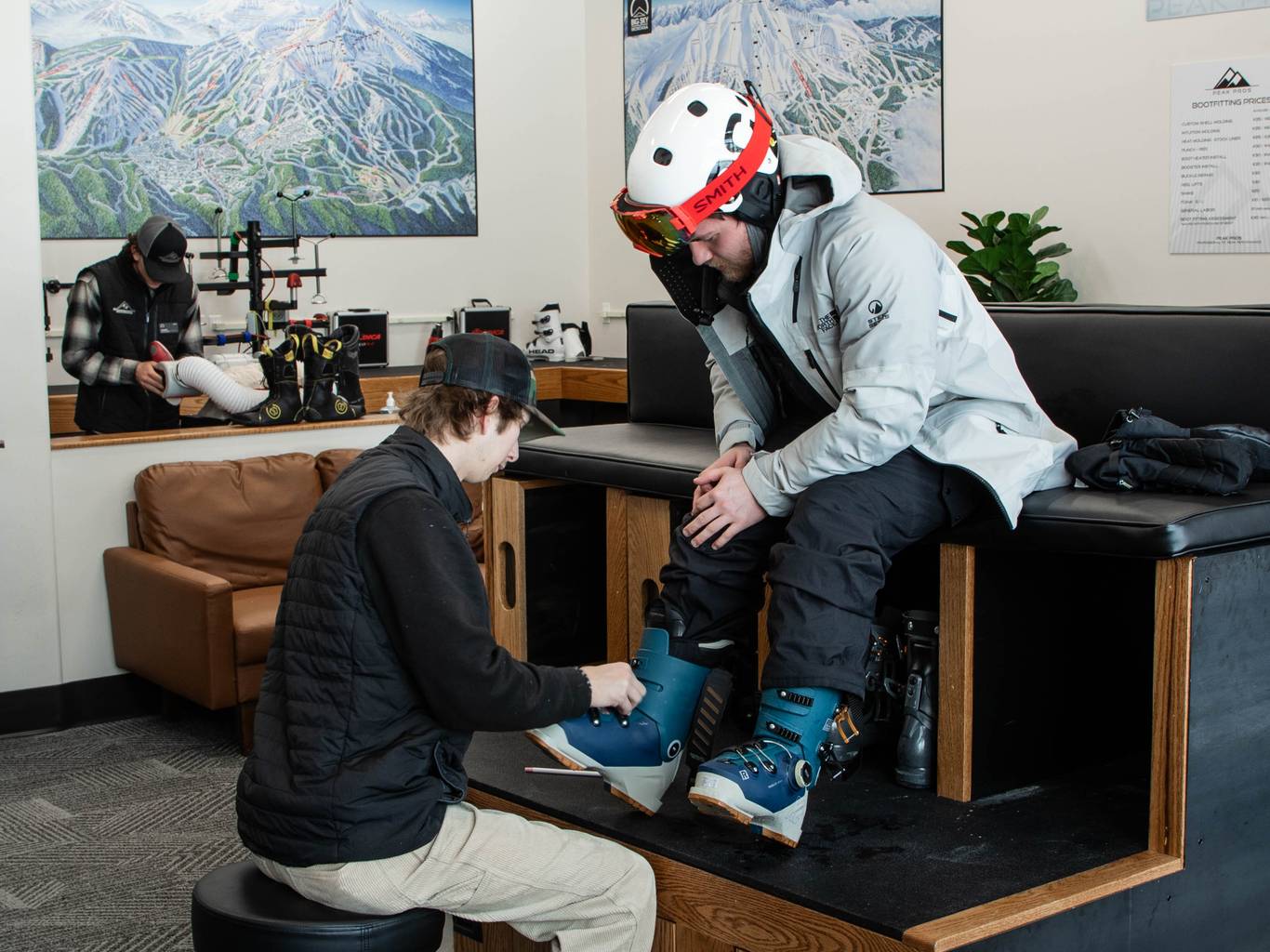 Person in a custom ski boot fitting session at Peak Pros