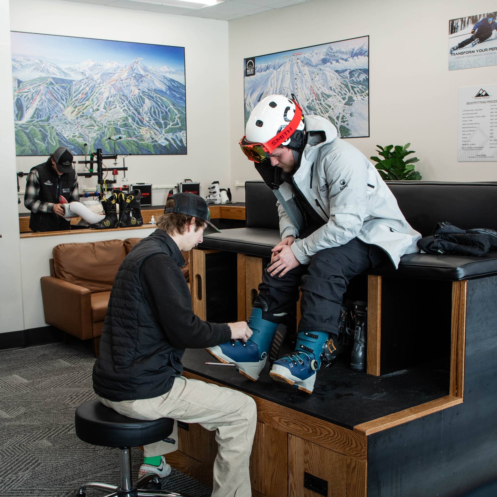 Person in a custom ski boot fitting session at Peak Pros