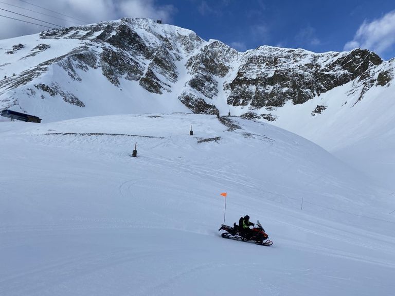 Blessley drives her snowmobile near the top of Powder Seeker lift