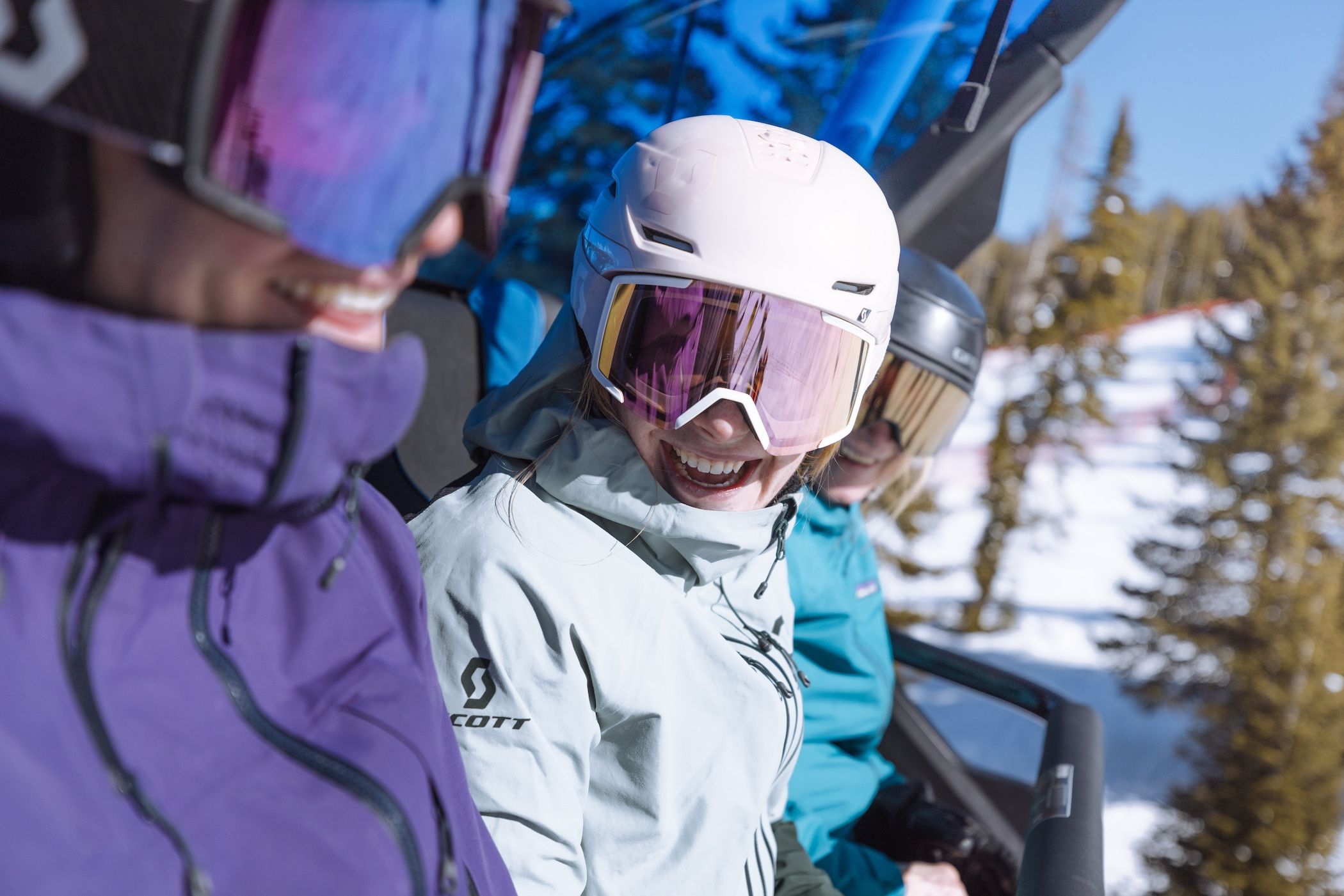 Group of women on a chairlift in ski gear
