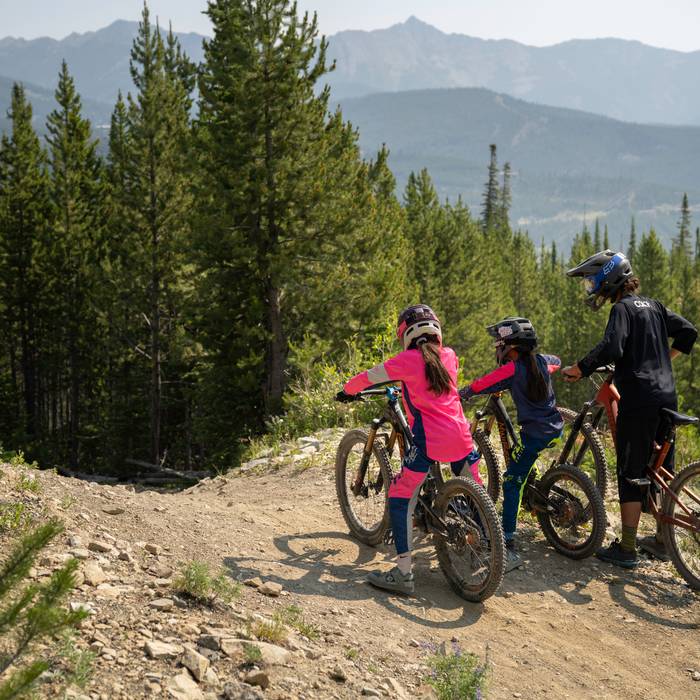 Kids in a group mountain bike lesson