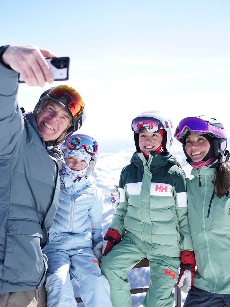 Family in ski gear taking a selfie