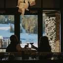 Couple cheersing drinks at Peaks Chophouse & Wine Lounge