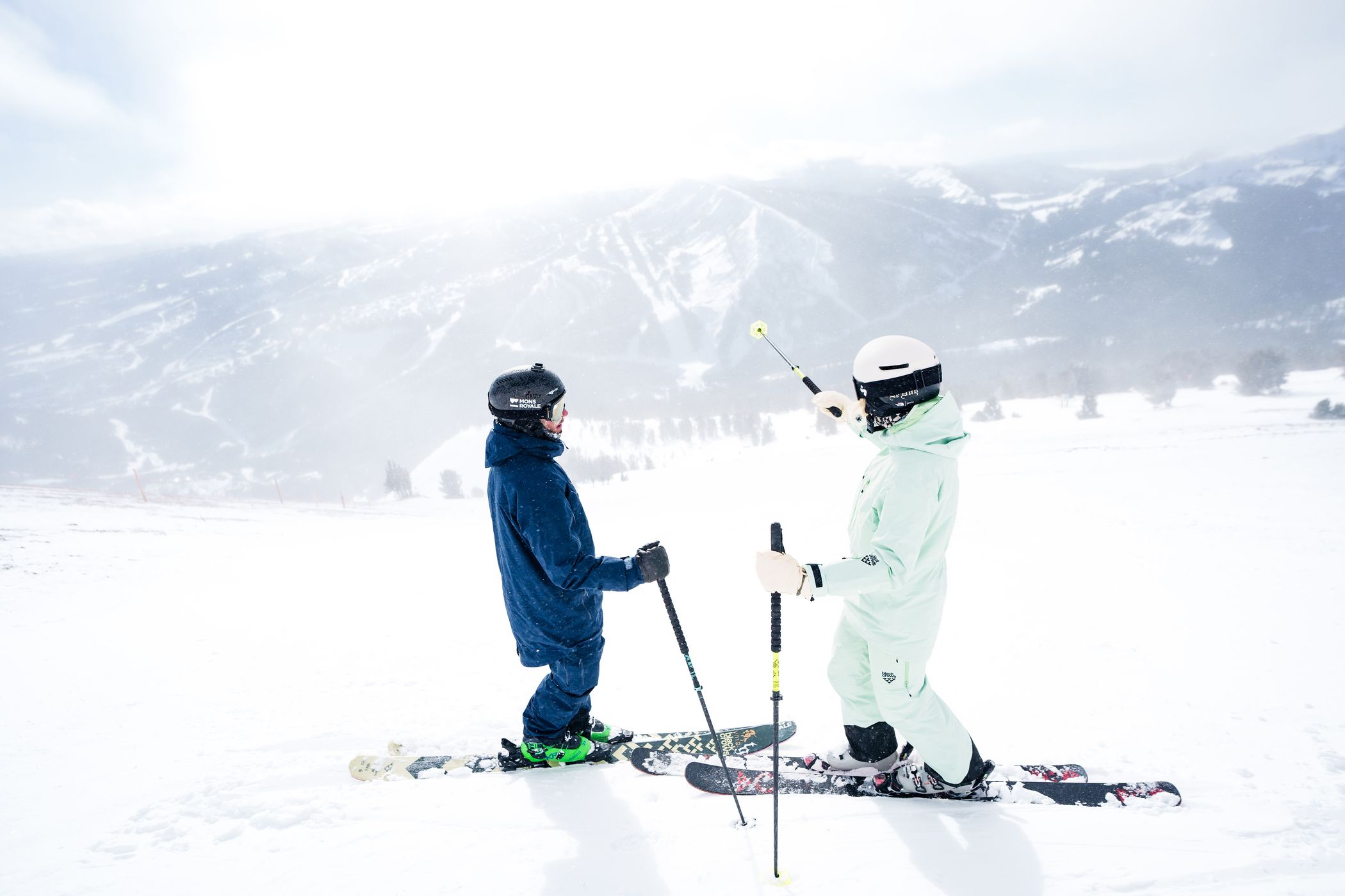 Skiers at the top of Lone Mountain