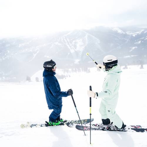 Skiers at the top of Lone Mountain
