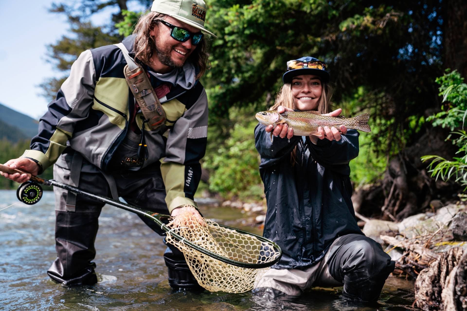 Two people fishing in a river
