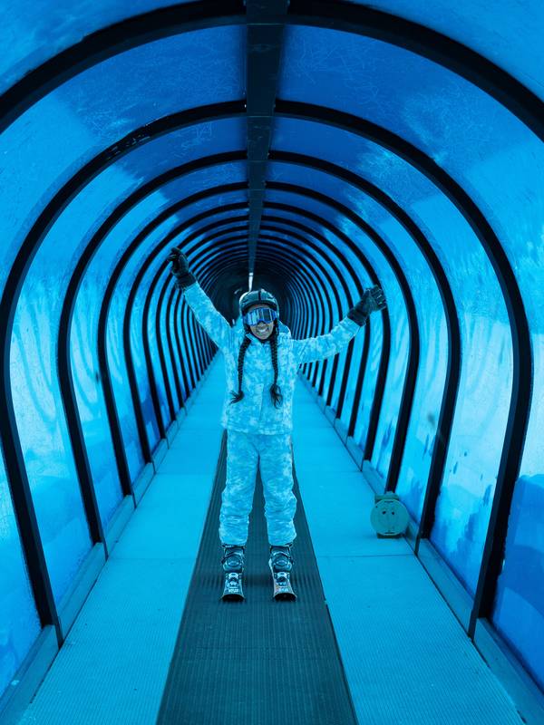 Girl on a blue covered magic carpet