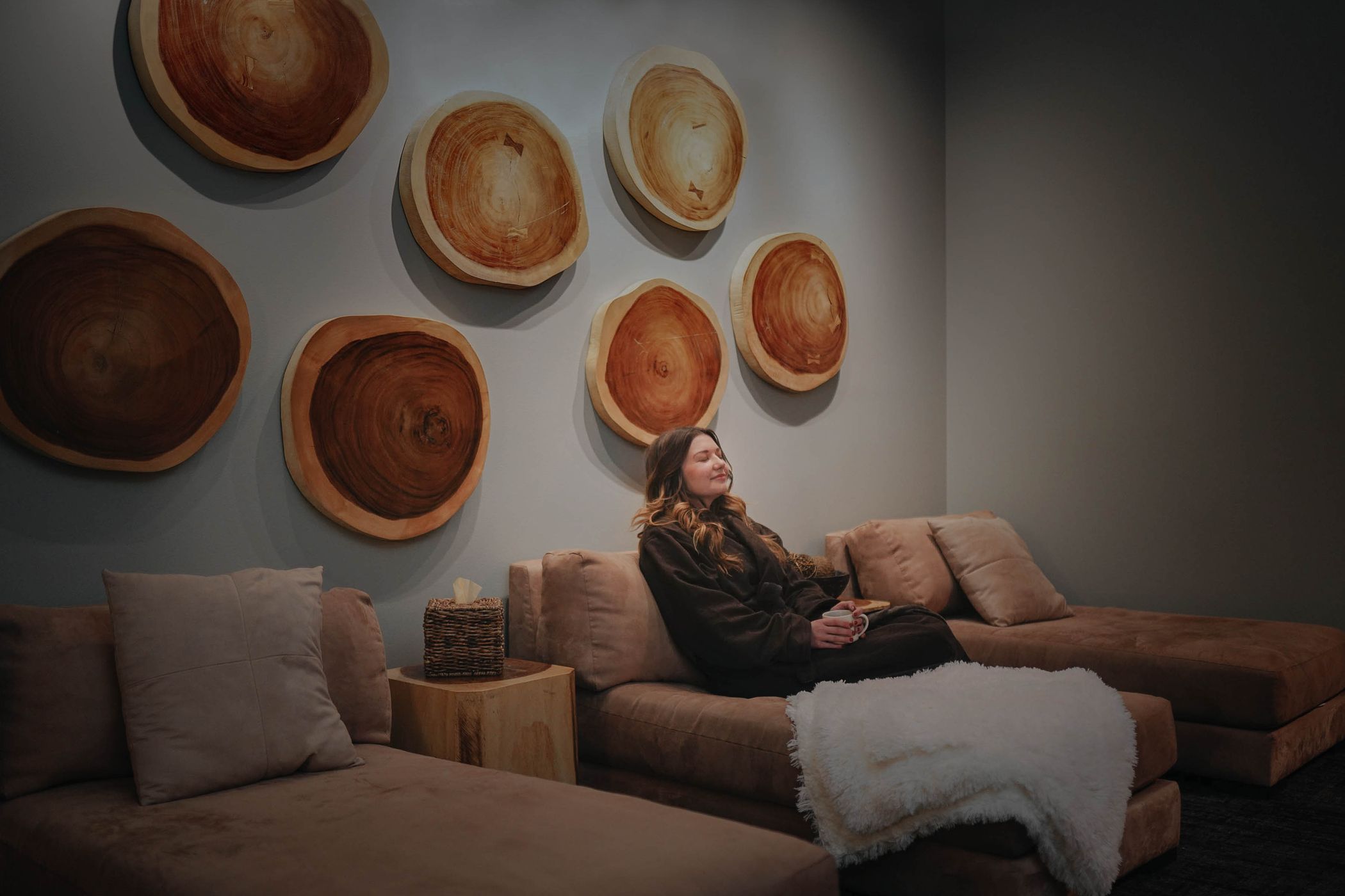 Woman relaxing in the lounge of the Solace Spa at Big Sky Resort, Montana
