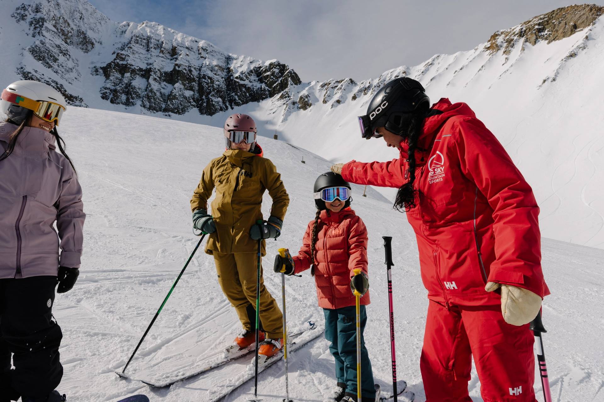 Family with a ski instructor