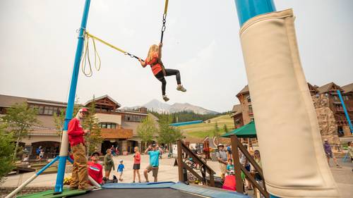Girl on a bungee trampoline