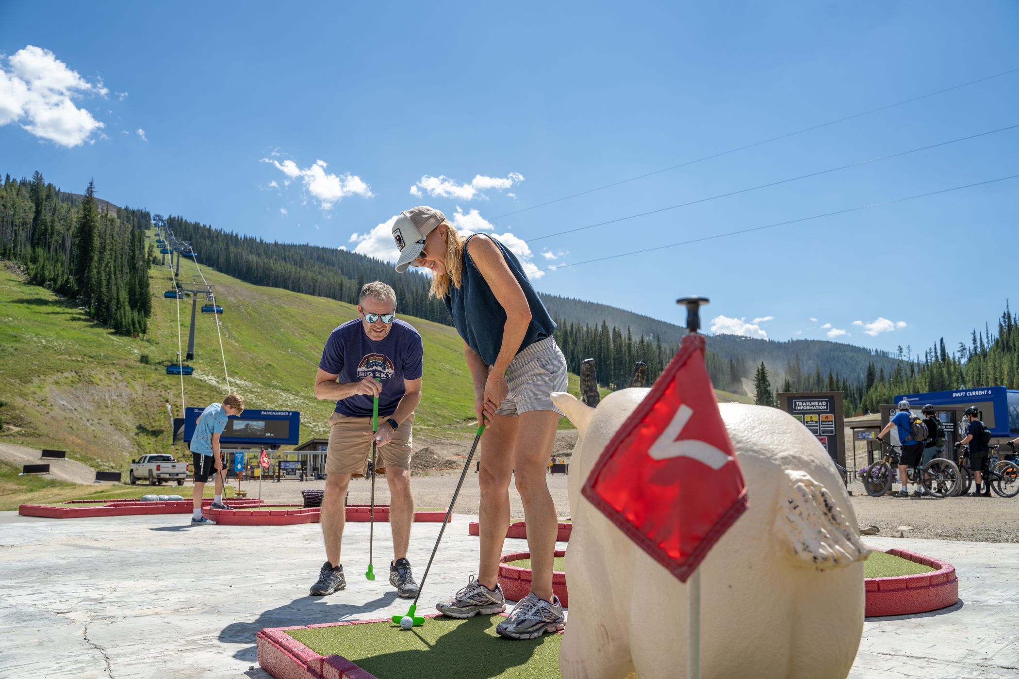 Family mini golfing at Big Sky Resort