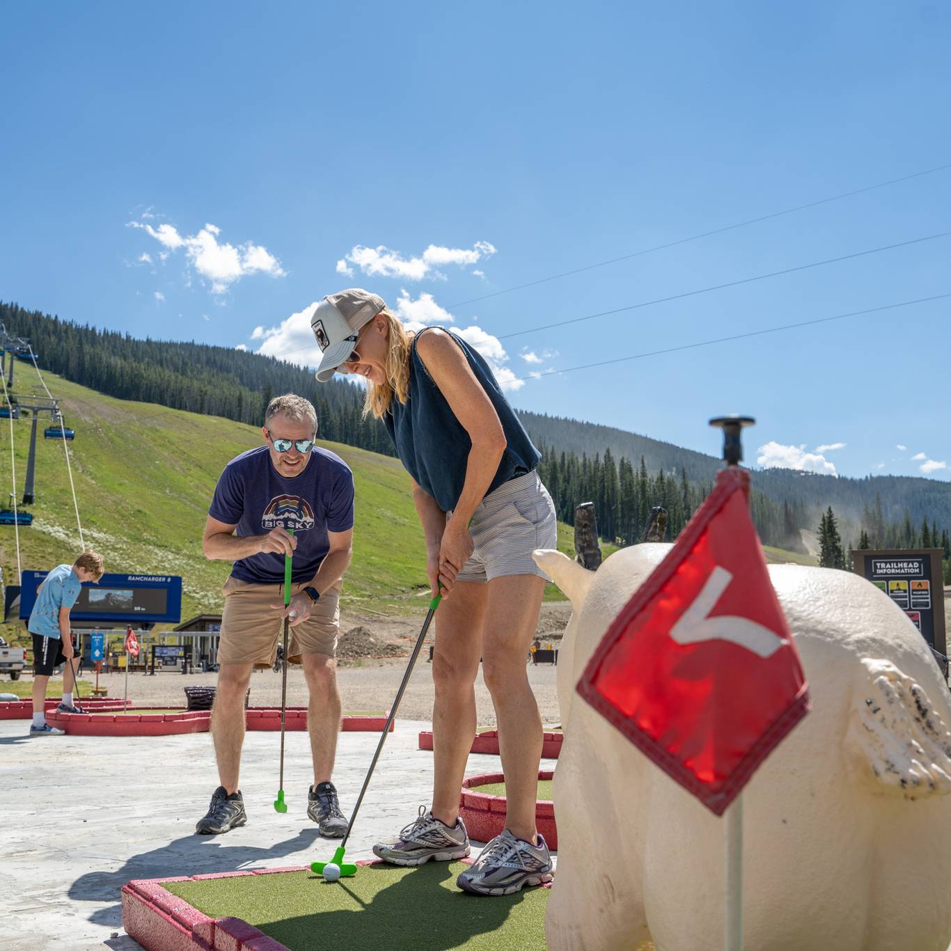 Family mini golfing at Big Sky Resort