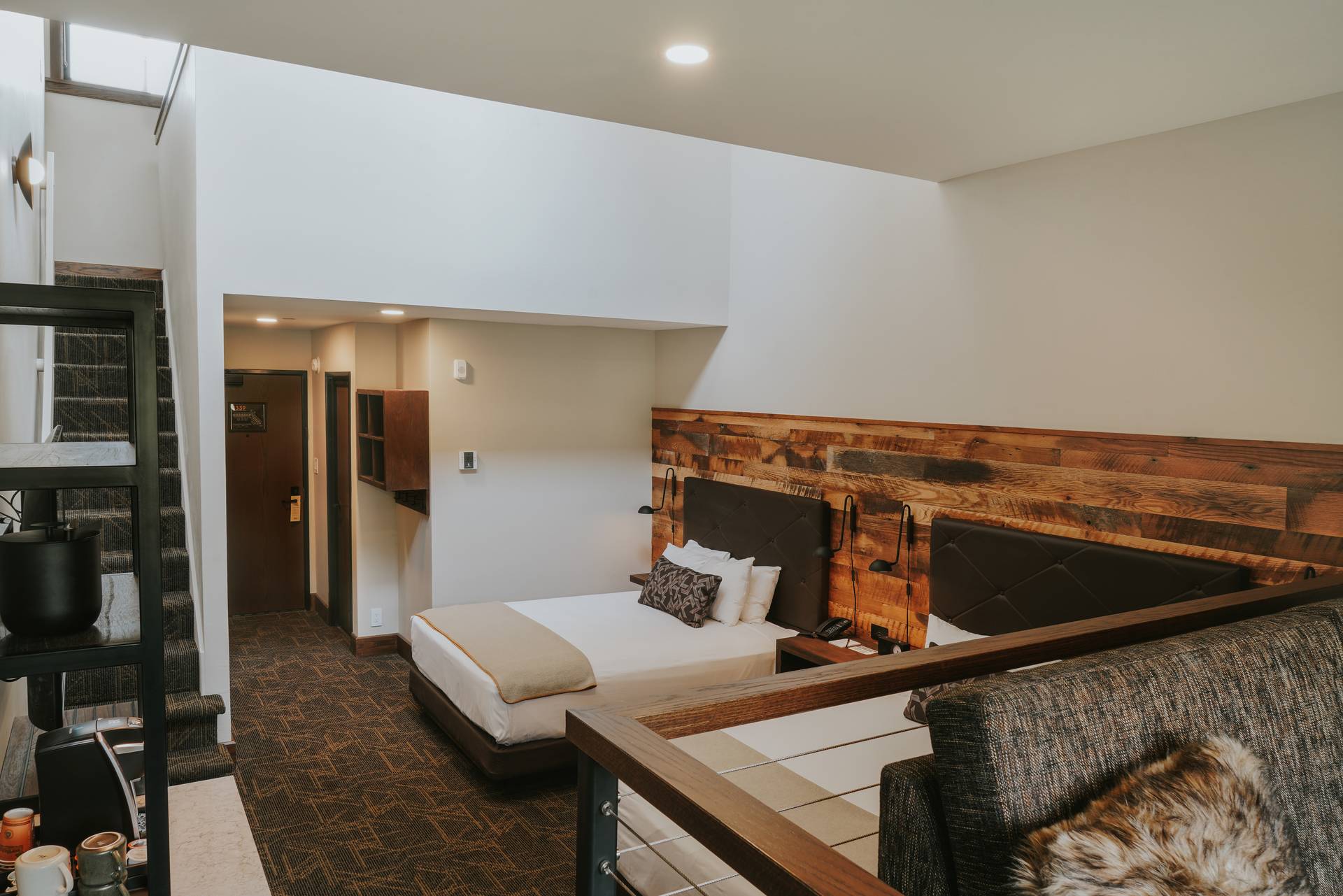 Huntley Lodge Loft hotel room bed area and entry