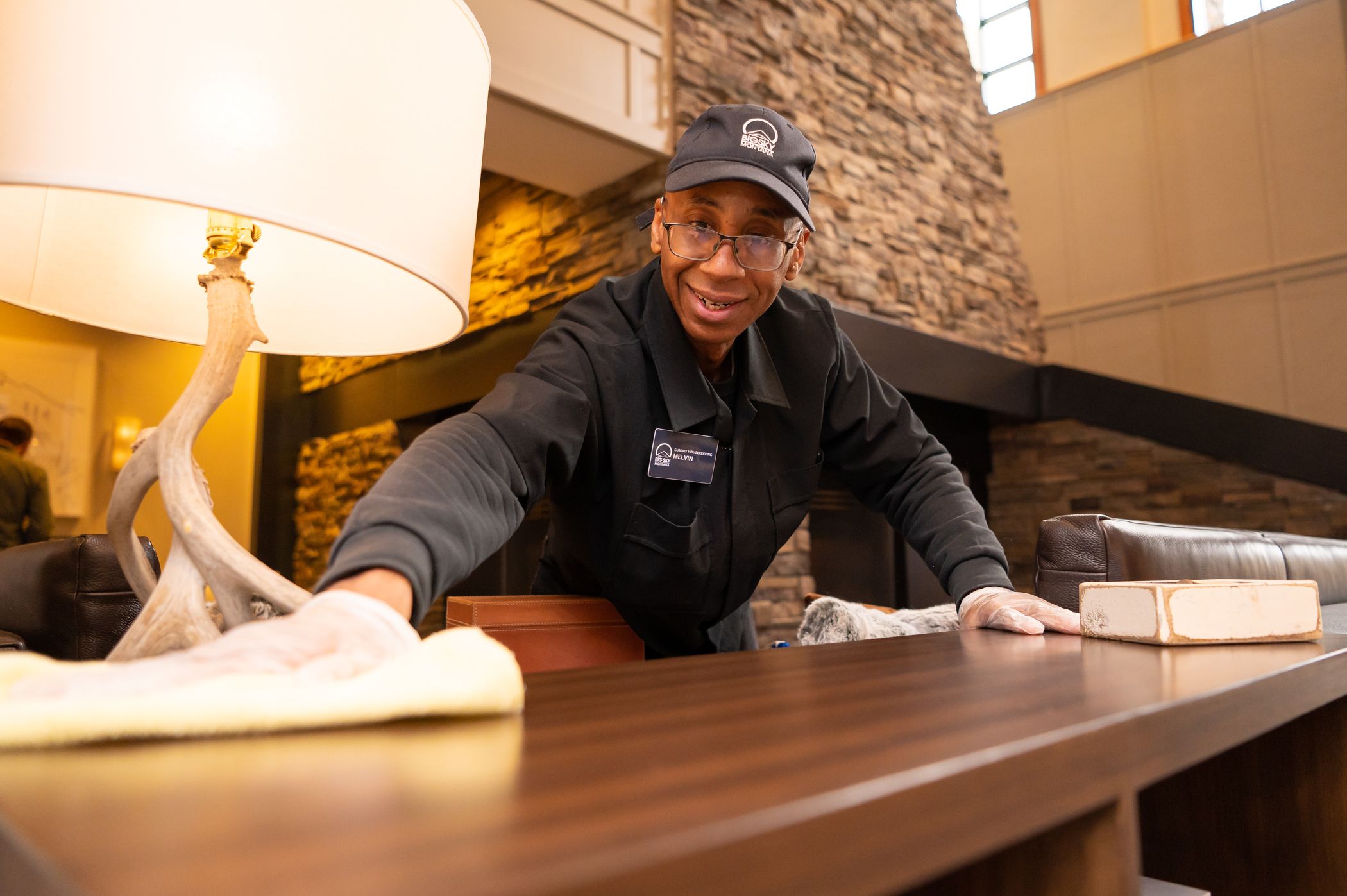 Man cleaning a table surface