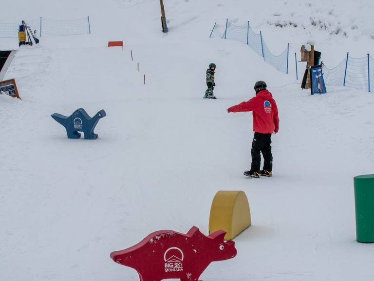 Reaching for dinosaurs in a kids lesson