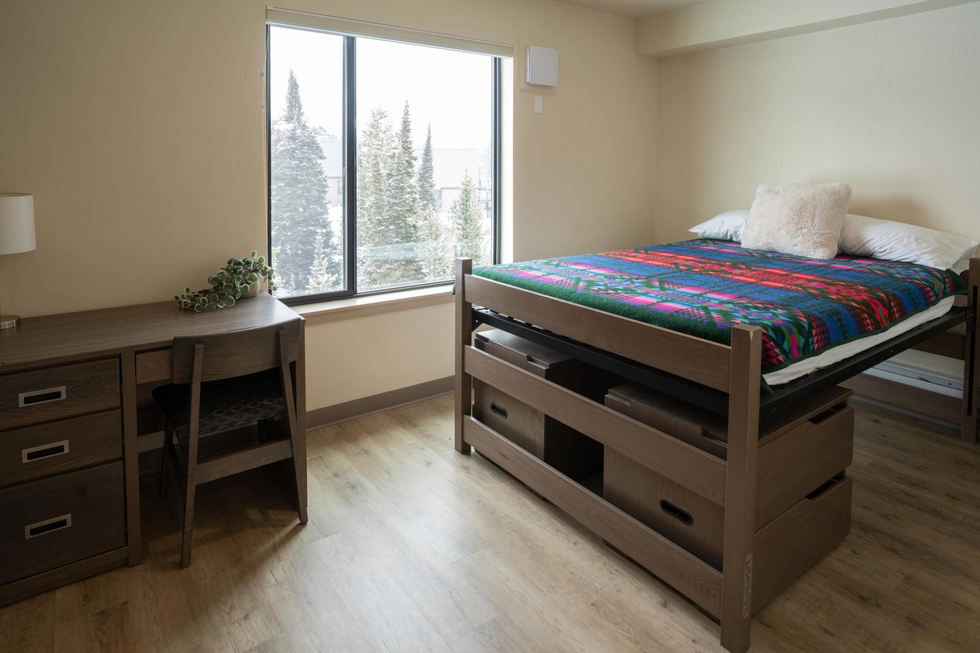 A single bedroom in one of the apartment style housing options