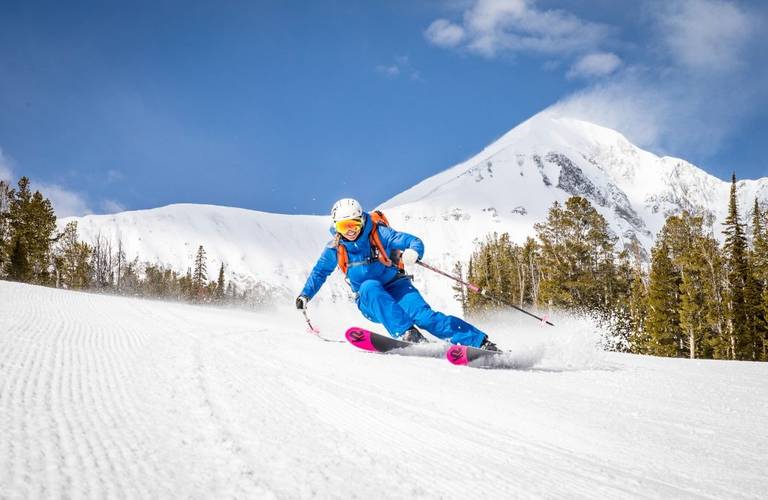 a skier carves down Mr K