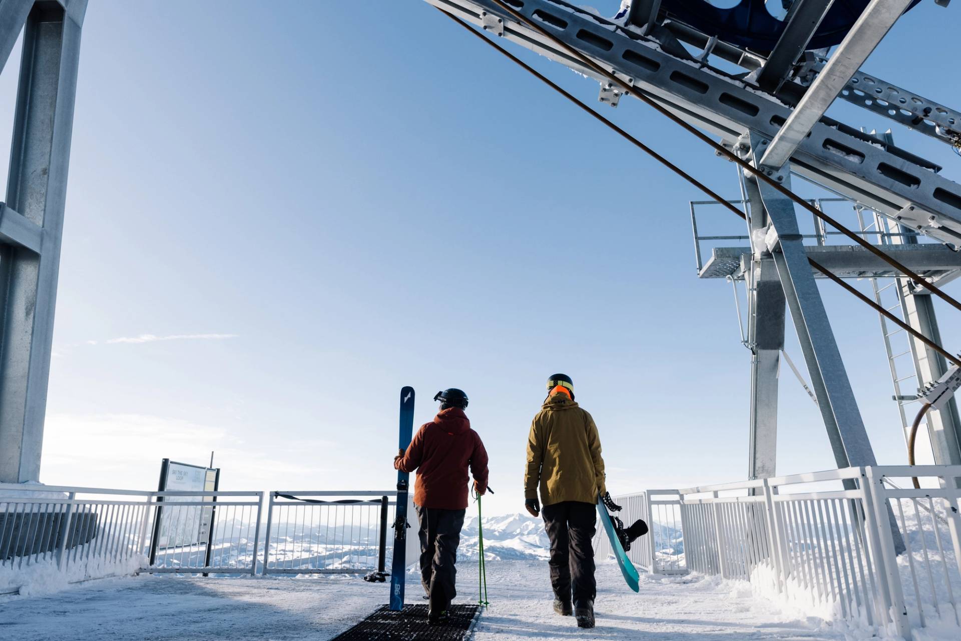 Skier and snowboarder at the top of the Lone Peak Tram