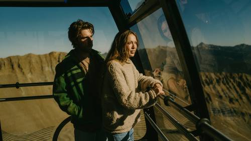 Couple on the Lone Peak Tram in summer