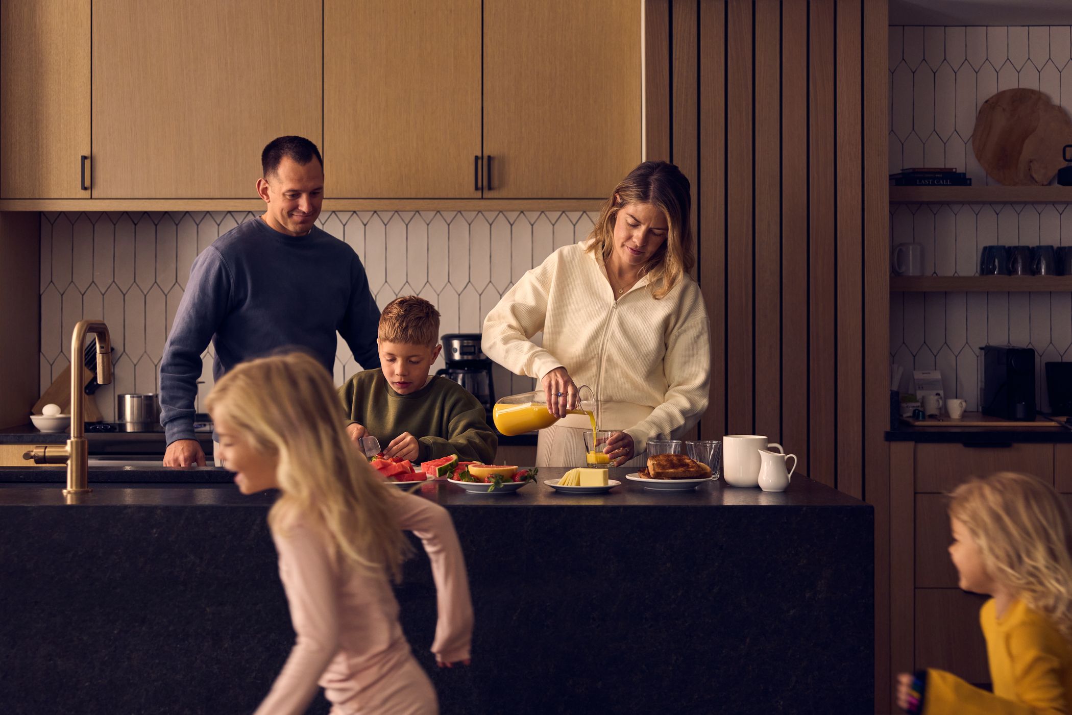 Family making breakfast in a Big Sky Resort hotel