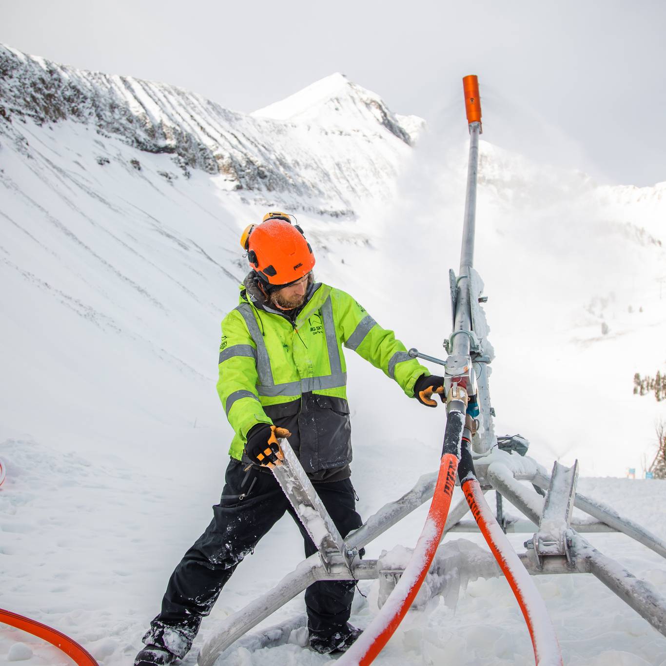 Man working on snowmaking equipment