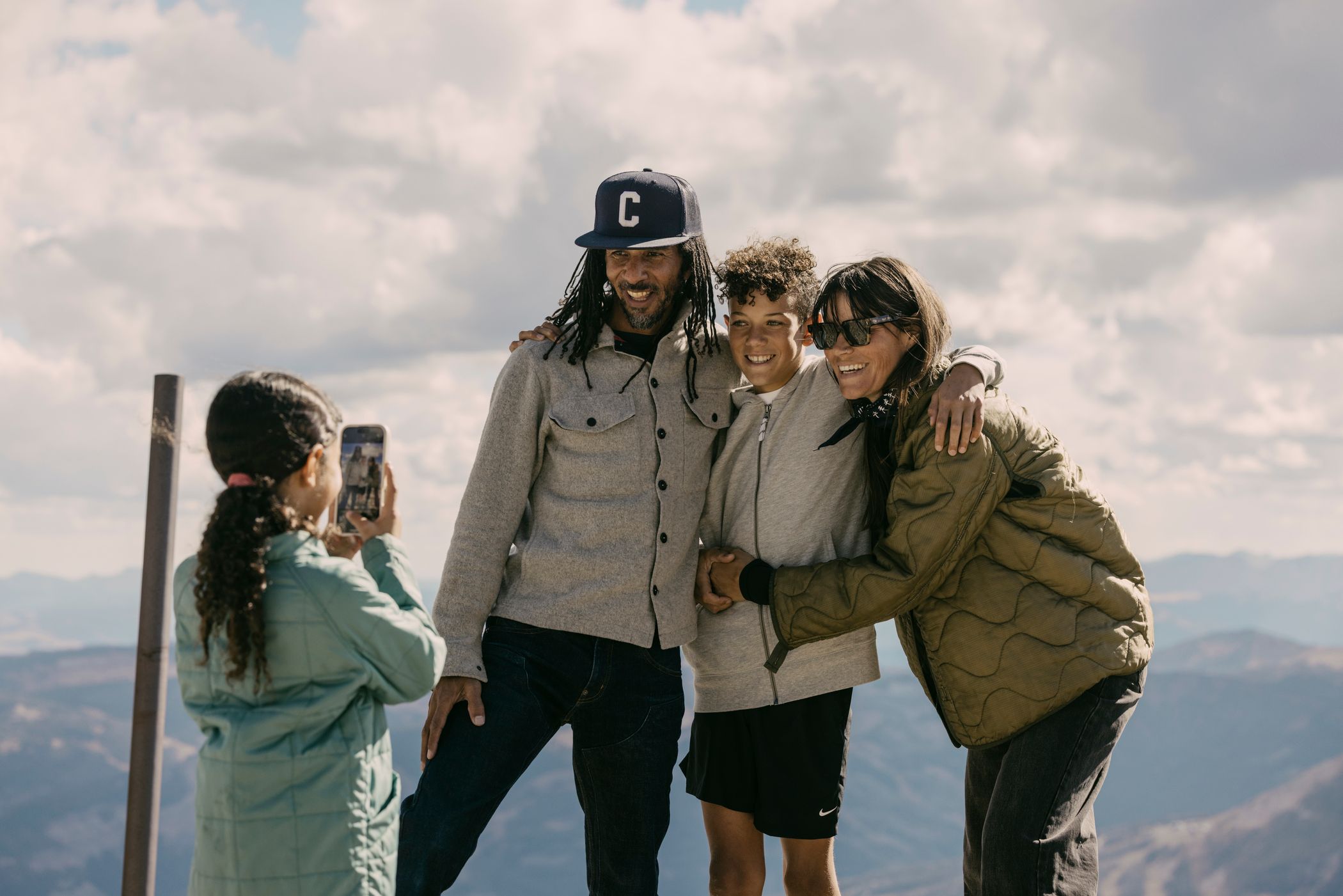 Girl taking a photo of her family