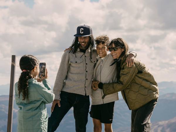 Girl taking a photo of her family