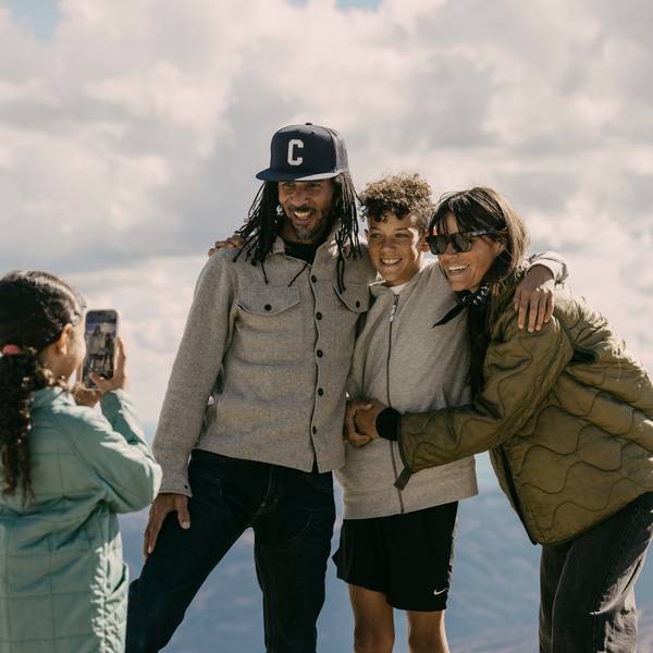 Girl taking a photo of her family