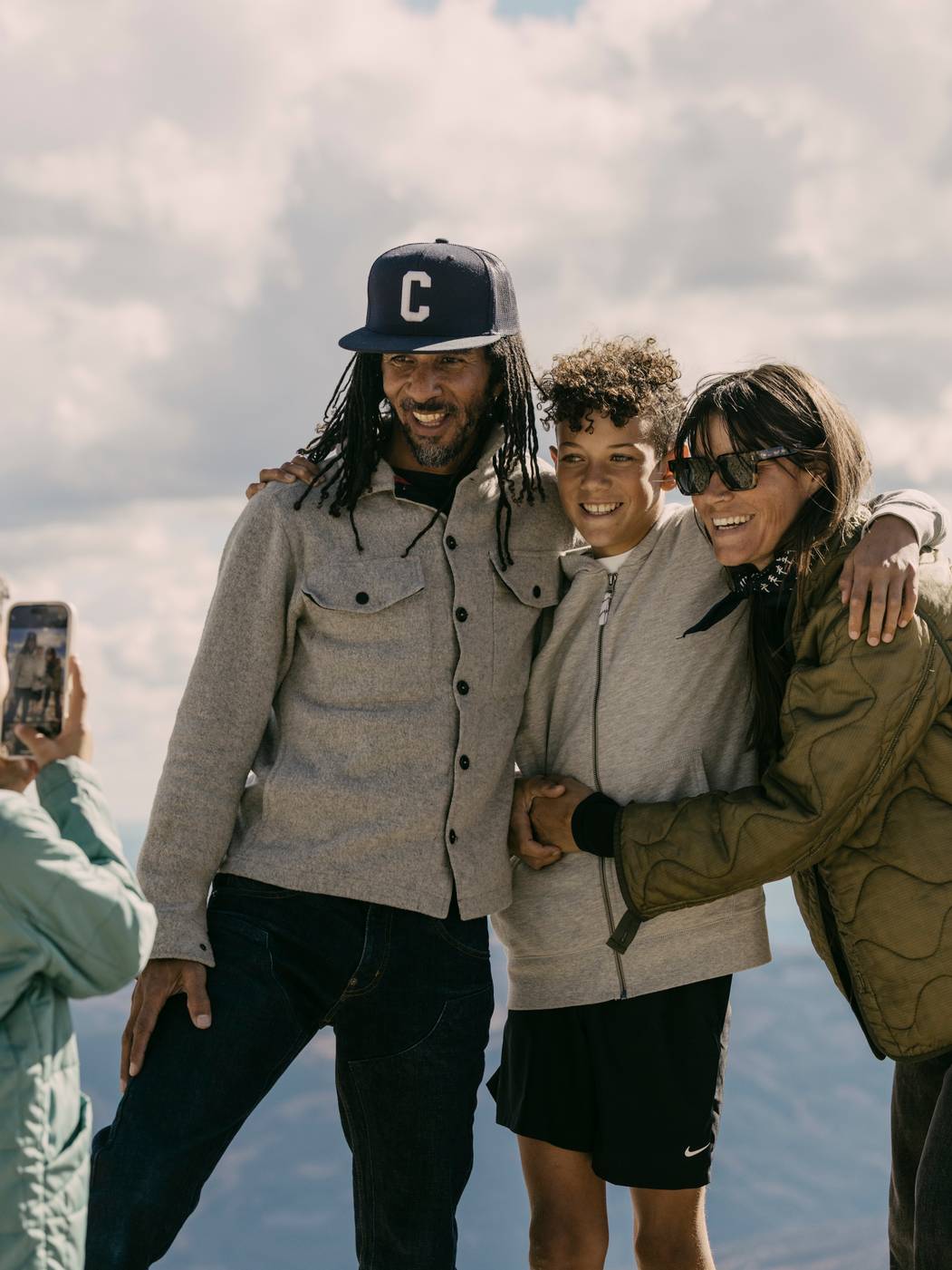 Girl taking a photo of her family