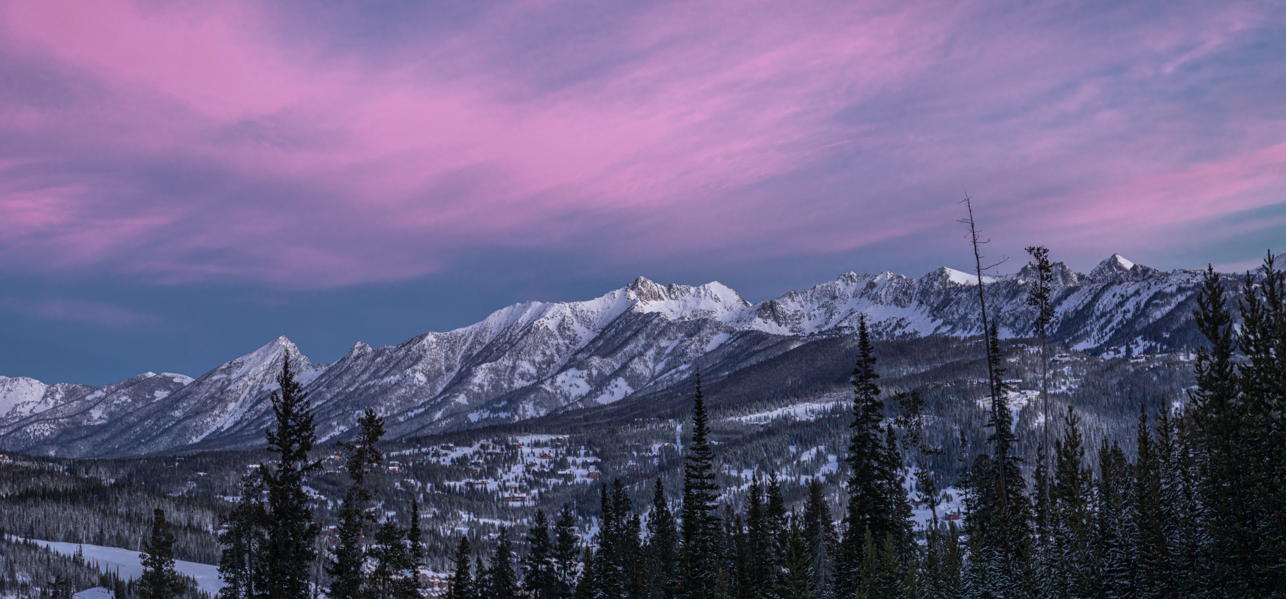 Sunrise over mountain peaks in winter
