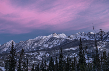 Sunrise over mountain peaks in winter
