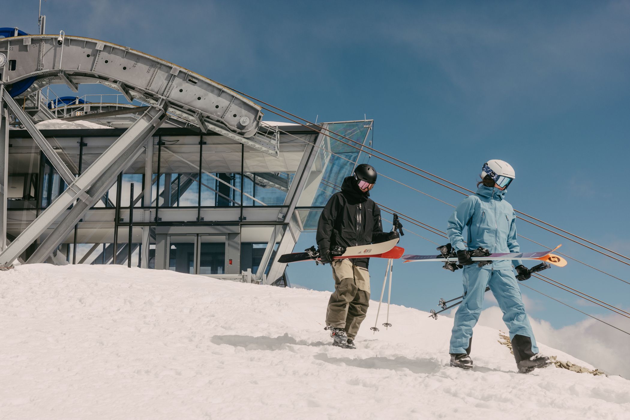Skier and snowboarder at the top of the Lone Peak Tram