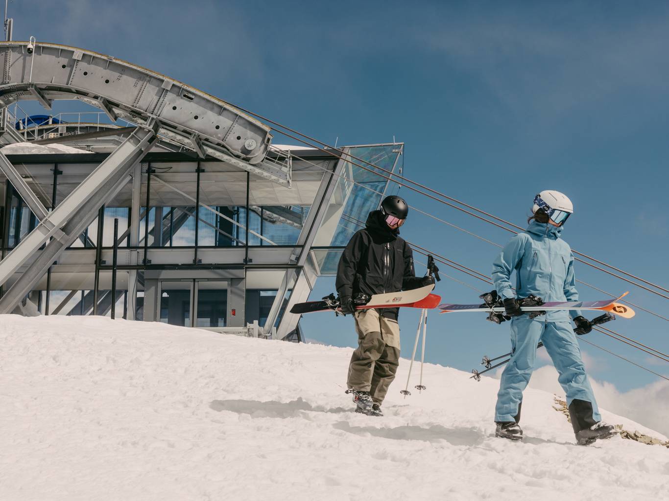 Skier and snowboarder at the top of the Lone Peak Tram